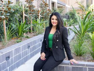 Image of BaptistCare tenant in the garden at her new home